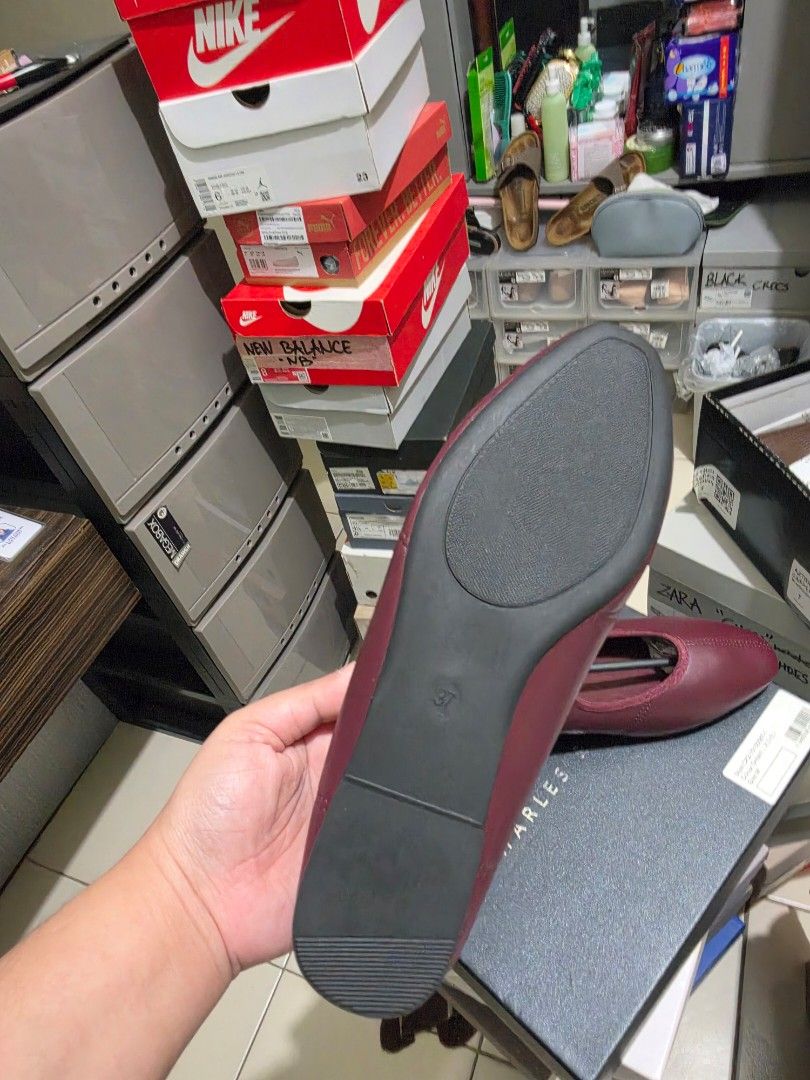 Burgundy slip-on flats size 37 (Category: Flats & Sandals) located in Pasig City. Submitted by cheribomb85 (Listing ID 1465755454, Image 3). Description: - Color: Rich burgundy / dark red - Size: 37 (printed on bottom) - Style: Convenient slip-on with a secure elastic top band - Condition: Clean soles, brand new - Freebie: Shoe trees included to maintain perfect shape - Versatile: Easy to match with many everyday outfits.