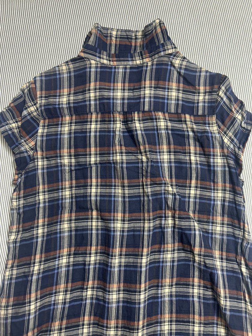 Button up blouse (Category: Blouses) located in Singapore. Submitted by swaninlouboutins (Listing ID 1465698313, Image 4). Description: Size: S to M ptp: 47.5 cm length: 69 cm - Material: Soft flannel-like fabric - Features: Short sleeves, button-front closure, classic collar, and stylish ruffle trim down the chest - Condition: Great for casual everyday wear or layering.