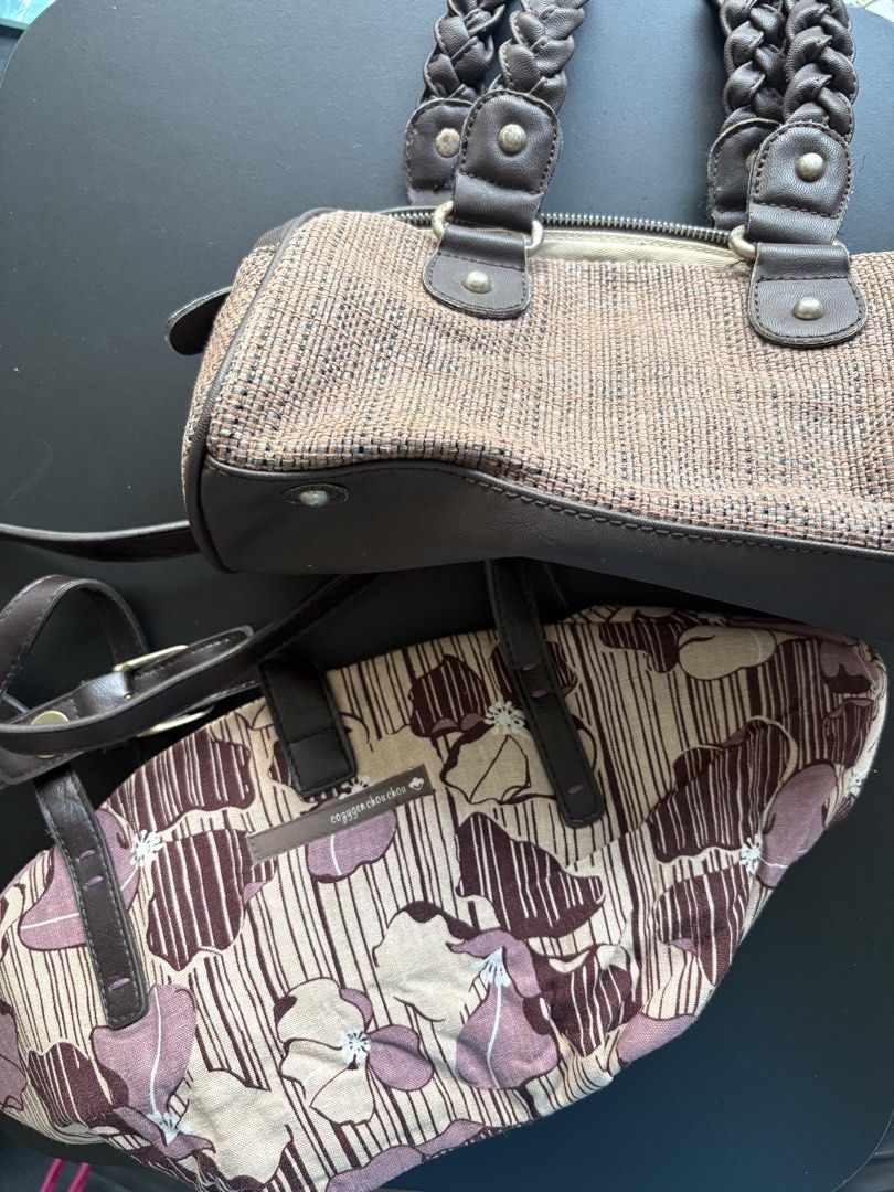 B1G1 Handbags (Category: Shoulder Bags) located in Manila. Submitted by curiouspicks (Listing ID 1465583034, Image 1). Description: - 2-in-1 Handbag Set: Includes a brown woven textured bag and a beige floral printed bag. - Spacious Interiors: Easily fits your wallet, phone, fans, and everyday essentials. - Design Details: Brown bag features braided handles and metal hardware; beige bag features thin straps and a front buckle closure. - Condition