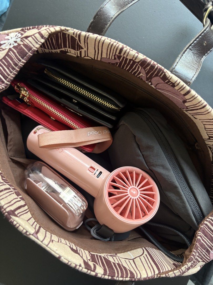 B1G1 Handbags (Category: Shoulder Bags) located in Manila. Submitted by curiouspicks (Listing ID 1465583034, Image 3). Description: - 2-in-1 Handbag Set: Includes a brown woven textured bag and a beige floral printed bag. - Spacious Interiors: Easily fits your wallet, phone, fans, and everyday essentials. - Design Details: Brown bag features braided handles and metal hardware; beige bag features thin straps and a front buckle closure. - Condition