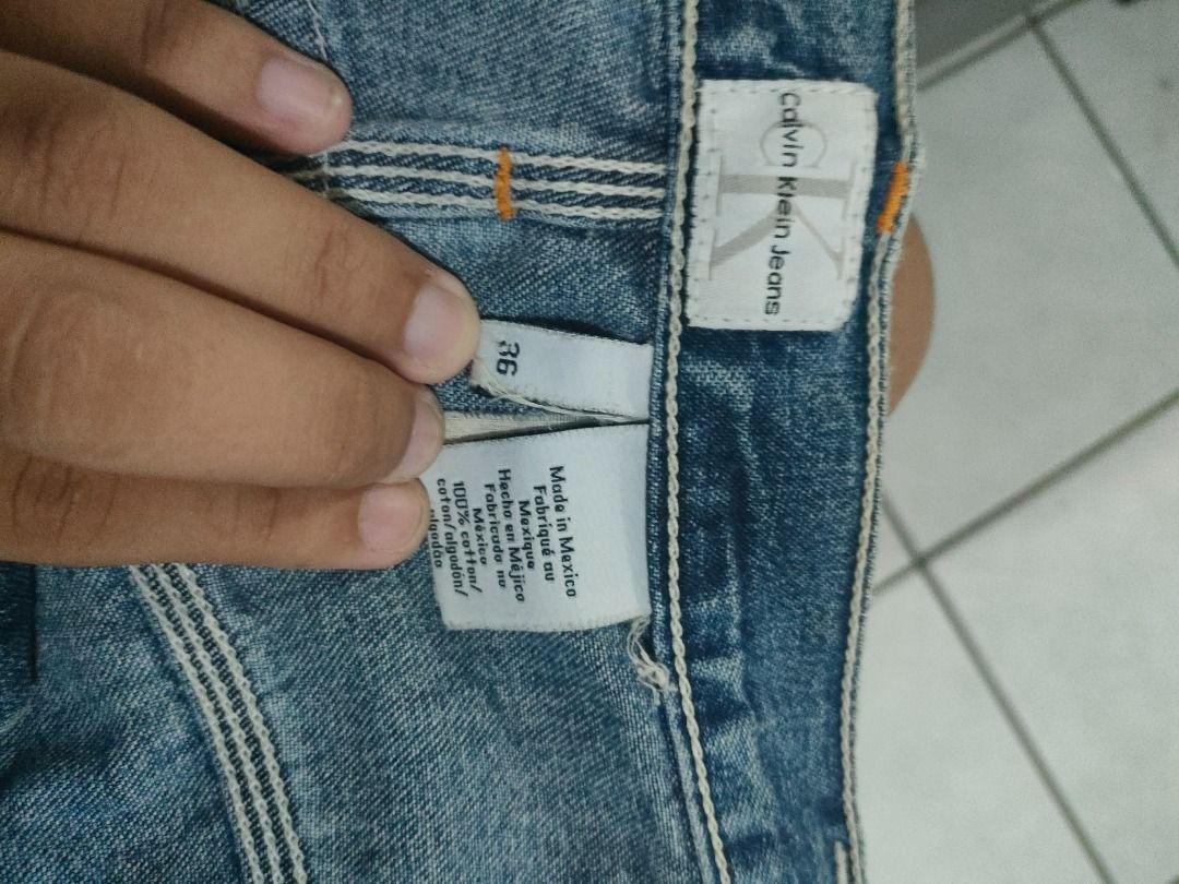 Calvin Klein Jeans Denim Shorts (Category: Shorts) located in Caloocan City. Submitted by odinfrancisco.347 (Listing ID 1465687124, Image 1). Description: - Brand: Calvin Klein Jeans - Size: 36 (tagged) - Color: Classic blue wash - Material: 100% cotton, made in Mexico - Style: Carpenter shorts with utility pockets and hammer loop - Details: Iconic CK woven patch on back waistband and durable contrast stitching - Condition: Good sturdy constructi