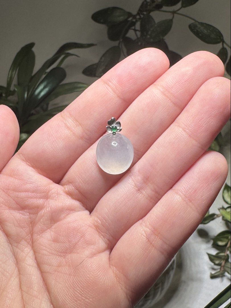 Caobchon Burmese jadeite pendant with 18k clasp (Category: Necklaces) located in Mandaluyong City. Submitted by kurokuropi (Listing ID 1465668452, Image 3). Description: - Oval / cabochon translucent Burmese jadeite pendant on 18k bail - Moonlight white (白月光）jelly and glowy quality jade - 18k white gold flower bail / pendant holder with a small round green guatemalan jadeite - Smooth cabochon that catches the light beautifully - With certificate 