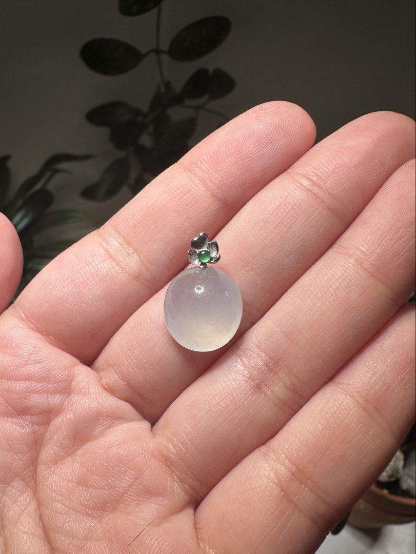 Caobchon Burmese jadeite pendant with 18k clasp (Category: Necklaces) located in Mandaluyong City. Submitted by kurokuropi (Listing ID 1465668452, Image 1). Description: - Oval / cabochon translucent Burmese jadeite pendant on 18k bail - Moonlight white (白月光）jelly and glowy quality jade - 18k white gold flower bail / pendant holder with a small round green guatemalan jadeite - Smooth cabochon that catches the light beautifully - With certificate 