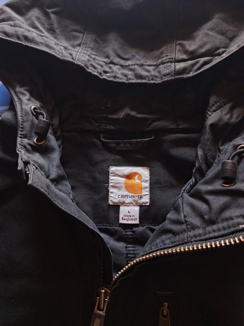 Carhartt Quick Duck 2000's (Category: Coats, Jackets and Outerwear) located in Calabanga. Submitted by bekneegear (Listing ID 1465658219, Image 3). Description: - Brand: Carhartt - Color: Blue - Size: Large - Material: Heavy cotton duck canvas - Features: Full zip closure, dual chest zip pockets, lower front pouch pockets, drawstring hood, ribbed hem and cuffs - Condition: Beater and Workwear condition - Origin: Made in Bangladesh.