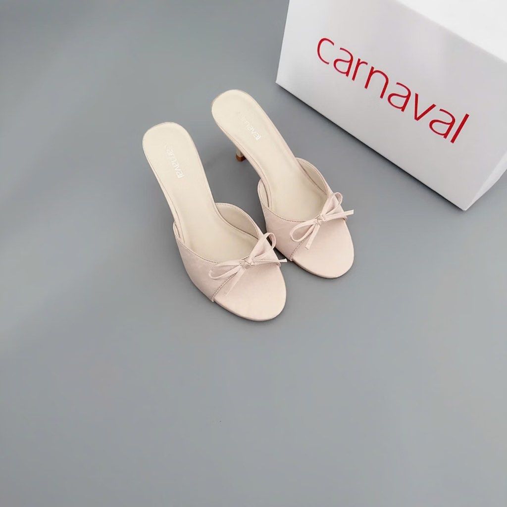 Carnaval 7cm High Heels (Category: Heels) located in Marikina City. Submitted by preloved_n_reloved (Listing ID 1465662988, Image 1). Description: - Brand: Carnaval - Style: slip-on heels with slim stiletto heel - Design: Open toe with a delicate bow on top - Condition: Clean and neatly kept - Inclusion: Original box included.