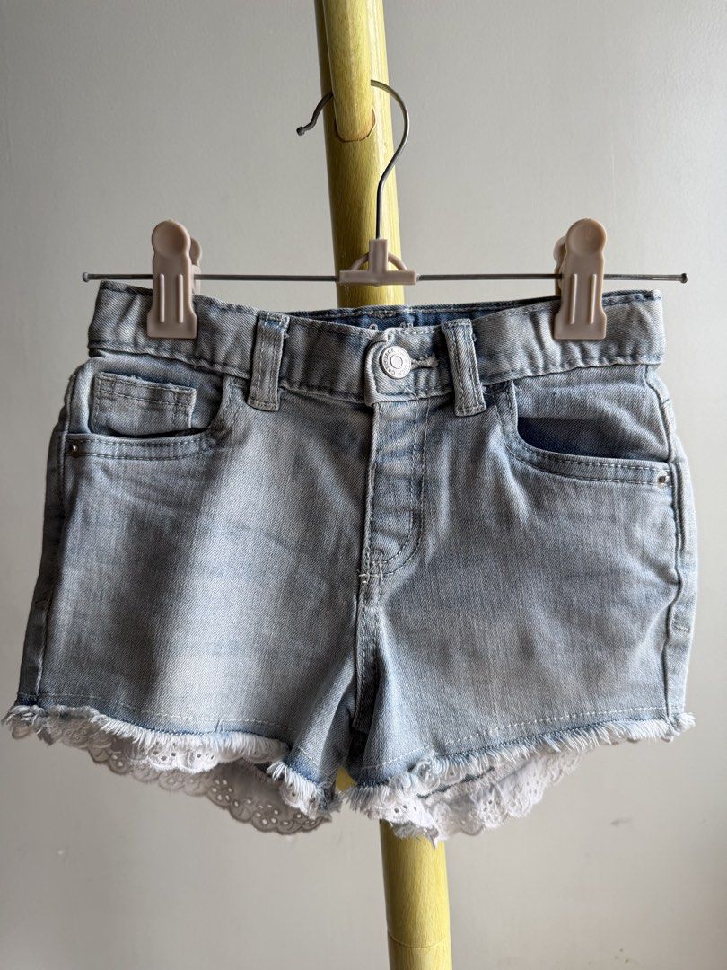 Cat & Jack Light Wash Denim Shorts Size 5T (Category: Babies & Kids Fashion) located in Quezon City. Submitted by warmrabbit_414908 (Listing ID 1465597535, Image 1). Description: - Brand: Cat & Jack - Size: 5T - Color: Light blue wash - Material: Super stretch denim - Features: Distressed raw hem with delicate white lace trim - Pockets: Functional front and back pockets - Fit: Belt loops and convenient inner waist adjuster - Origin: Made in Vietn