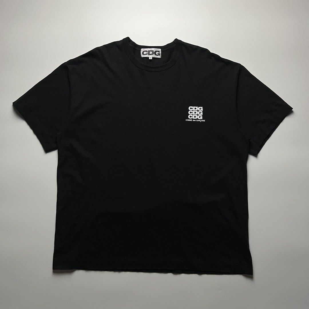 CDG Comme des Garcons Triple Stack Logo Tee (Category: Tshirts & Polo Shirts ) located in Manila. Submitted by streetsavvy (Listing ID 1465666016, Image 1). Description: CDG Comme des Garçons Triple Stack Logo Tee Size: Medium Width: 25” Length: 30” Shoulder: 23” Sleeve Length: 9” Hem: 25.5” Measured in Inches Condition: Excellent condition Flaw: none Made in Japan 100% Cotton.