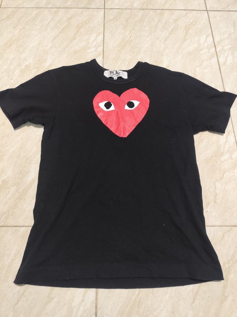 CDG play COMME des Garcons Red Heart (Category: Shirts) located in Manila. Submitted by buyybustt (Listing ID 1465703054, Image 1). Description: 17.5x25 Issue Small Pinhole(See pic).