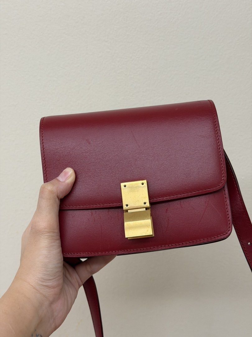 Celine Classic Box Bag Red Leather (Category: Luxury Bags & Wallets) located in Manila. Submitted by tashvintagefinds (Listing ID 1465636804, Image 2). Description: - Authentic Celine classic box bag - size small - Red calfskin - overall condition is nice but there are sratches/marks (shown in photos) - slightly nego.