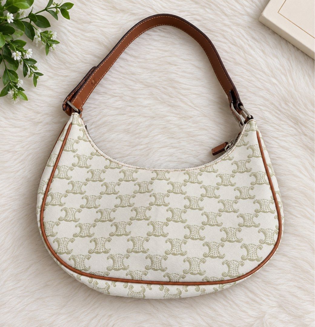 Celine kili-kili Bag (Category: Luxury Bags & Wallets) located in Dagupan City. Submitted by vallureph (Listing ID 1465581847, Image 1). Description: - Authentic Celine shoulder bag in classic white and tan Macadam monogram canvas - Features premium brown leather trim and an adjustable strap - Secure top zip closure with clean tan fabric interior lining - Includes official serial number tag (F-GA-0290) and Made in Italy stamp - Trendy curved hobo