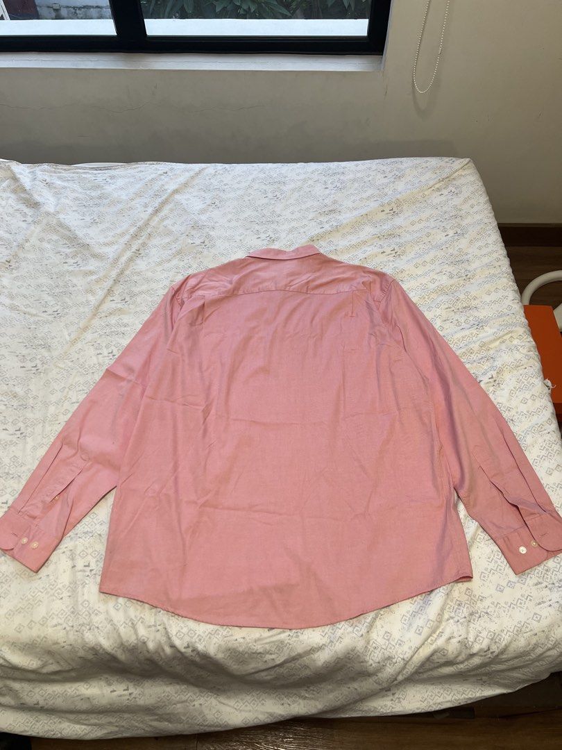Celio* Pink Longsleeve Button-Down Shirt (XL) (Category: Formal Shirts) located in Paranaque City. Submitted by primefinds.ph (Listing ID 1465665845, Image 2). Description: - Size XL (25” x 31”) - Celio* tag 8/10 condition Issue: stains on lower left .
