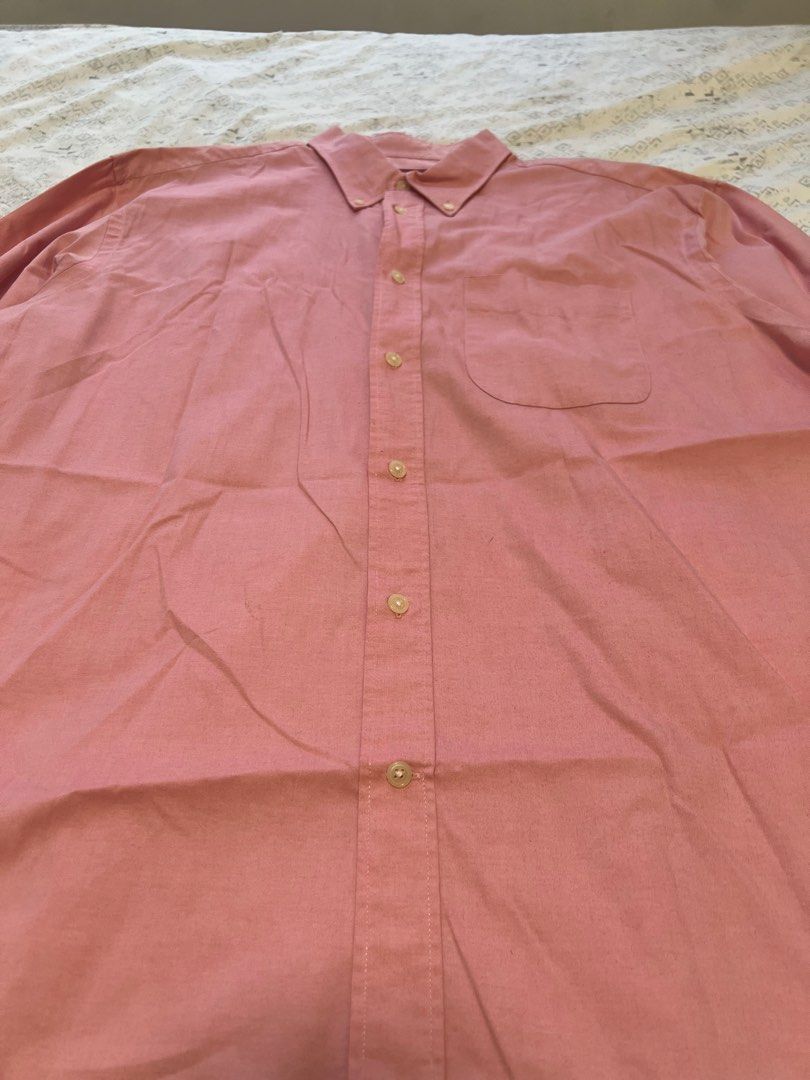 Celio* Pink Longsleeve Button-Down Shirt (XL) (Category: Formal Shirts) located in Paranaque City. Submitted by primefinds.ph (Listing ID 1465665845, Image 3). Description: - Size XL (25” x 31”) - Celio* tag 8/10 condition Issue: stains on lower left .