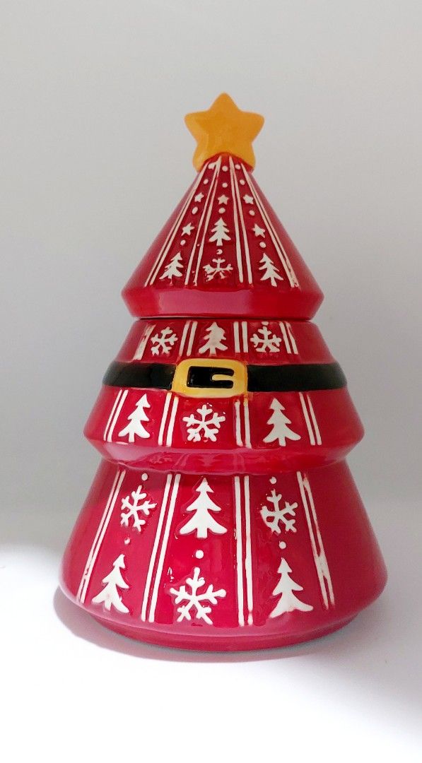 Ceramic Santa Christmas Tree Cookie Jar with Lid (Category: Everything Else Others) located in Cainta. Submitted by veronica2277 (Listing ID 1465621447, Image 1). Description: - Festive red ceramic Christmas tree cookie jar - Decorated with a Santa belt, white trees, and snowflakes - Yellow star acts as a convenient lid handle - Removable lid for easy refilling with cookies or candy - Great holiday decor for your kitchen counter or dining table b