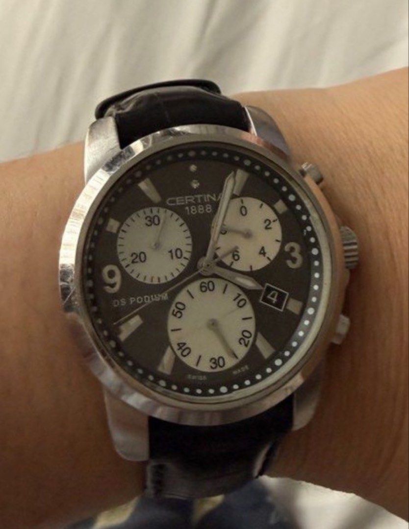 Certina DS Podium Chronograph Watch (Category: Luxury Watches) located in Quezon City. Submitted by anastoreonline (Listing ID 1465582451, Image 2). Description: - Brand: Certina DS Podium Chronograph - Dial: Black with white subdials and date window between 4 and 5 o'clock - Case & Strap: Stainless steel case with black leather strap and deployment clasp - Movement: Swiss-made quartz - Condition: Classic daily wearer with normal minor desk marks
