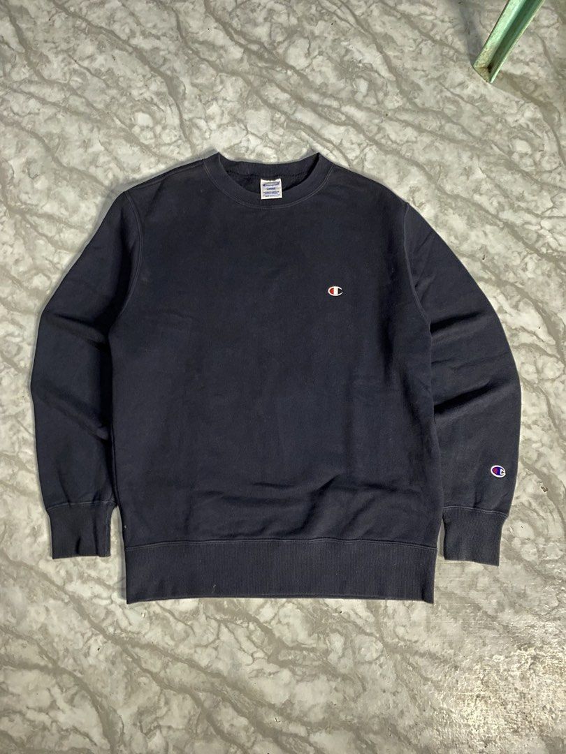 Champion Reverse Weave Crewneck (Category: Coats, Jackets and Outerwear) located in Calabanga. Submitted by 4405.curator (Listing ID 1465593291, Image 2). Description: Classic black Champion crewneck sweatshirt. Embroidered logo on the chest and smaller logo patch on the left sleeve cuff. Ribbed collar, cuffs, and hem keep their shape well. Tag shows size Large. Great basic piece for everyday layering. Comfortable fleece lining inside..