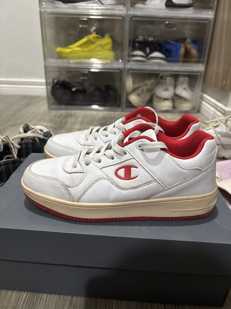 Champion White and Red Low-Top Sneakers (Category: Sneakers) located in San Pablo. Submitted by loved.goods0501 (Listing ID 1465700079, Image 2). Description: Brand: Champion Size: EUR 38 Condition: Midsole has natural yellowing from age and wear. Soles show visible dirt and scuffing from past use no box, just shoes.