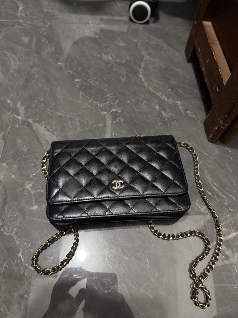 Chanel Black Quilted Leather Flap Bag (Category: Luxury Bags & Wallets) located in Manila. Submitted by bilog_khairmuchuan (Listing ID 1465609529, Image 1). Description: - Brand: Chanel - Material: Black quilted lambskin leather - Hardware: Gold-tone - Closure: Interlocking CC turn-lock on front flap - Interior: Burgundy fabric lining with zipped pocket and gold heat-stamped logo - Special Feature: Snap button pocket under the flap - Strap: Inter
