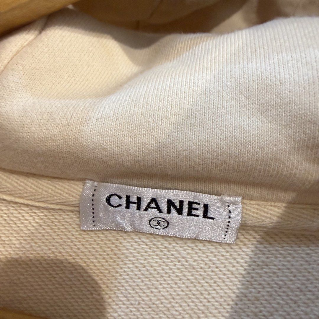 Chanel Cream Graphic Hoodie (Category: Hoodies) located in Manila. Submitted by carbungcoalex (Listing ID 1465612456, Image 3). Description: CHANEL CREAM HOODIE 22 by 27.5 Good Condition Complete tags 2K CLAIM.