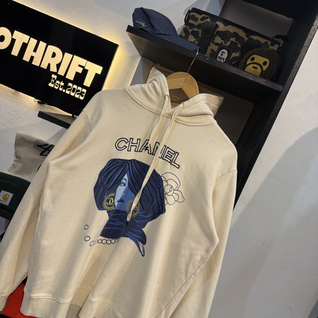 Chanel Cream Graphic Hoodie (Category: Hoodies) located in Manila. Submitted by carbungcoalex (Listing ID 1465612456, Image 2). Description: CHANEL CREAM HOODIE 22 by 27.5 Good Condition Complete tags 2K CLAIM.