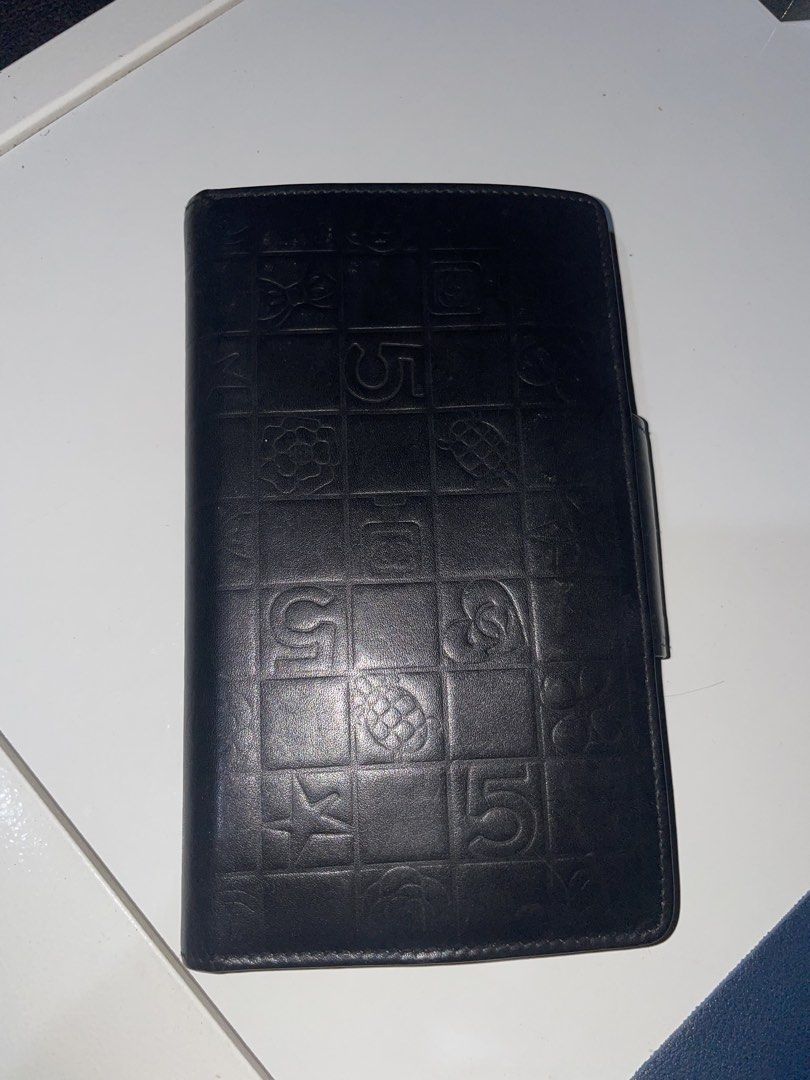 Chanel Wallet (Category: Wallets & Card holders) located in Caloocan City. Submitted by wisteria00 (Listing ID 1465742550, Image 2). Description: Model: Chanel Icon Line BiFold Kisslock Wallet Price: ₱11,500 This is a pre-loved vintage item. • Functionality: 10/10. Kisslock snaps tight. No holes. • Aesthetics: 7/10. Shows normal signs of usage. INCLUSIONS: • Wallet + Authenticity Card North Caloocan.