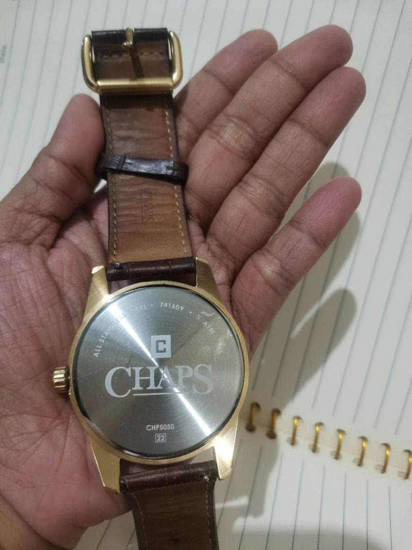Chaps CHP5050 Gold Tone Watch (Category: Women's Watches) located in Manila. Submitted by mahanaim.67c328 (Listing ID 1465745256, Image 2). Description: - Brand: Authentic Chaps Analog Watch (Model CHP5050) - Dial: Textured silver with classic Arabic numerals and 3 sub-dials (day, date, 24-hour display) - Case: Elegant gold-tone with all stainless-steel back - Strap: Dark brown faux-Croco leather with gold buckle closure - Water Resistance: Up to