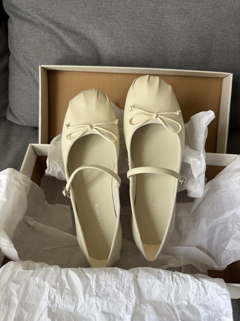 Charles & Keith Mary Janes Ballet Flats (Category: Flats & Sandals) located in Manila. Submitted by d_clutter_ (Listing ID 1465682287, Image 1). Description: Style: Covered Mary Janes flat with front bow and dainty strap Color: Chalk Size: EU 35 (I'm a US 6/6.5) Condition: Brand New Rfs: didn't get to use them on my wedding day!.