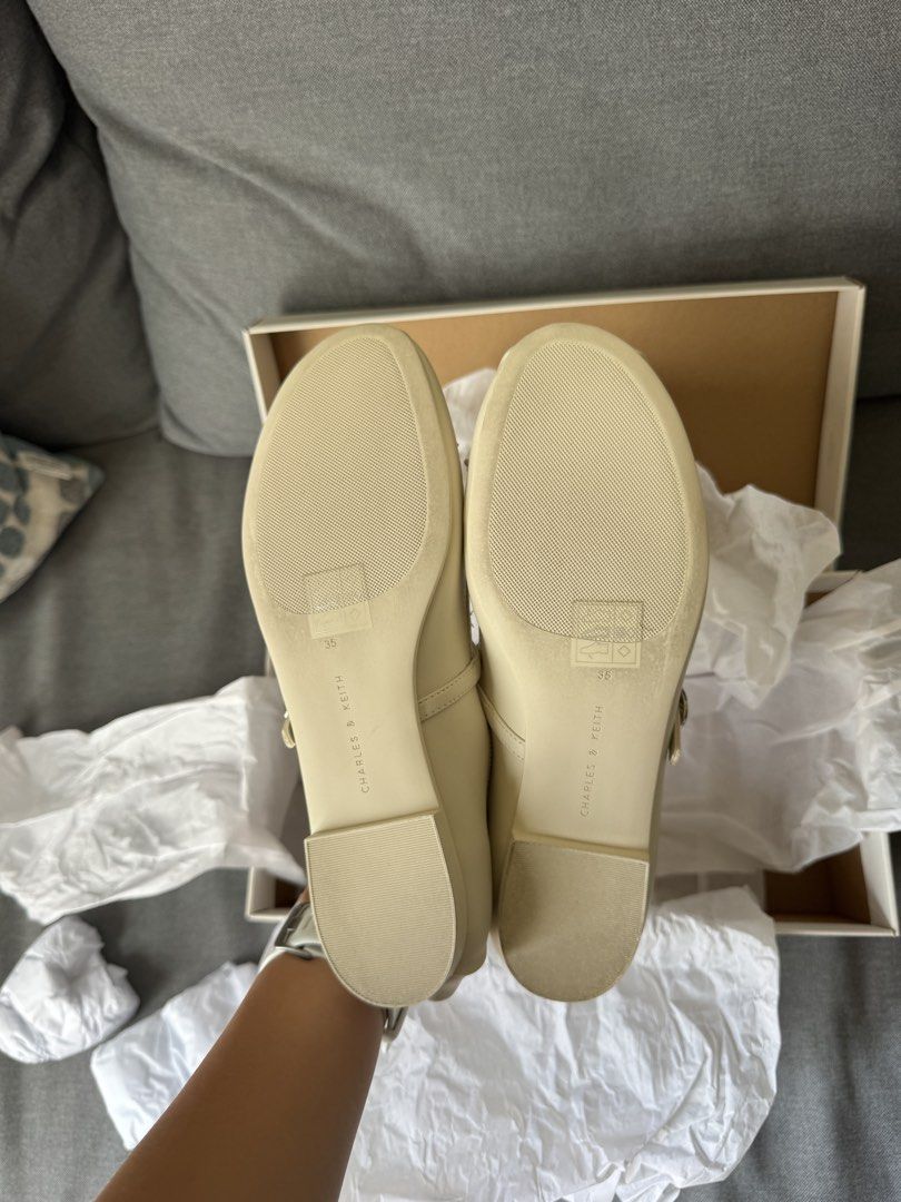 Charles & Keith Mary Janes Ballet Flats (Category: Flats & Sandals) located in Manila. Submitted by d_clutter_ (Listing ID 1465682287, Image 3). Description: Style: Covered Mary Janes flat with front bow and dainty strap Color: Chalk Size: EU 35 (I'm a US 6/6.5) Condition: Brand New Rfs: didn't get to use them on my wedding day!.