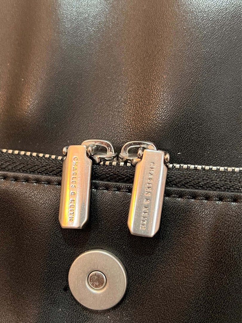 CHARLES & KEITH OCTAVIA FRONT-FLAP BACKPACK (Category: Backpacks) located in Manila. Submitted by nlgll (Listing ID 1465695629, Image 3). Description: FOR SALE CHARLES & KEITH OCTAVIA FRONT-FLAP BACKPACK Selling my Charles & Keith Octavia Front-Flap Backpack – Noir for ₱4,200 Details: * Authentic Charles & Keith * Color: Noir/Black * Material: Calf PU * Magnetic closure * Adjustable & detachable straps * Dimensions: 30 × 25–34 × 13 cm * Spacious 
