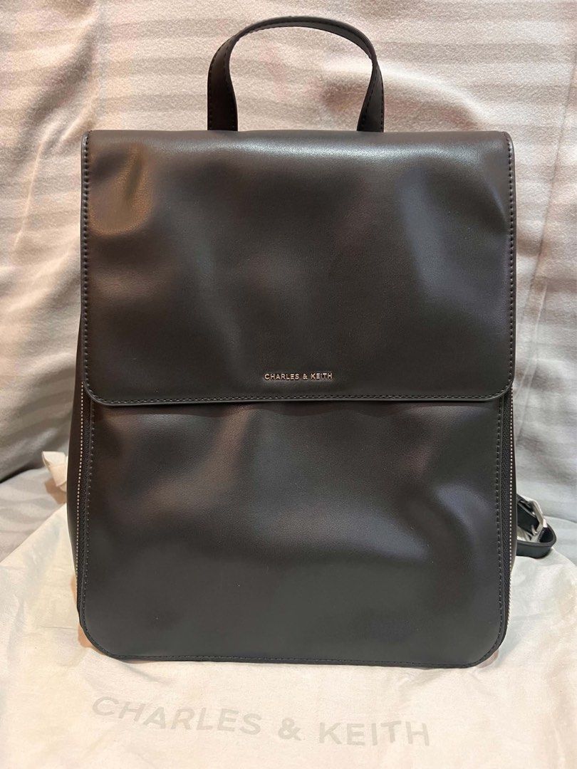 CHARLES & KEITH OCTAVIA FRONT-FLAP BACKPACK (Category: Backpacks) located in Manila. Submitted by nlgll (Listing ID 1465695629, Image 1). Description: FOR SALE CHARLES & KEITH OCTAVIA FRONT-FLAP BACKPACK Selling my Charles & Keith Octavia Front-Flap Backpack – Noir for ₱4,200 Details: * Authentic Charles & Keith * Color: Noir/Black * Material: Calf PU * Magnetic closure * Adjustable & detachable straps * Dimensions: 30 × 25–34 × 13 cm * Spacious 