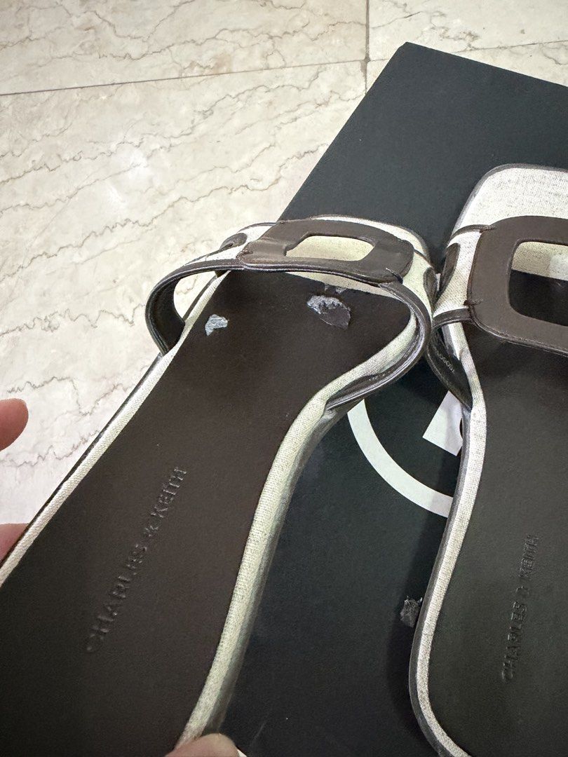 Charles & Keith Sandals size 39 (with flaws) (Category: Flats & Sandals) located in San Juan City. Submitted by smjose (Listing ID 1465641731, Image 3). Description: - Brand: Charles & Keith. Original - Size: 39 - Color: Brown and Cream - Style: Chic flat slip-on sandals with cut-out design - Condition: Pre-loved, still functional and usable, but has noticeable inner leather flaking No more box .