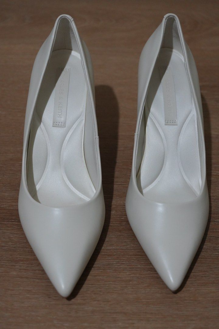 Charles & Keith White Stiletto Pumps (Category: Heels) located in Cainta. Submitted by karsssss (Listing ID 1465756857, Image 1). Description: - Brand: Charles & Keith - Color: Chalk White - Style: Pointed Stiletto Pumps - Design: Classic and versatile - Occasion: Perfect for work/wedding/ events - Features: Comfortable padded insoles, moderate heel height - size 37.
