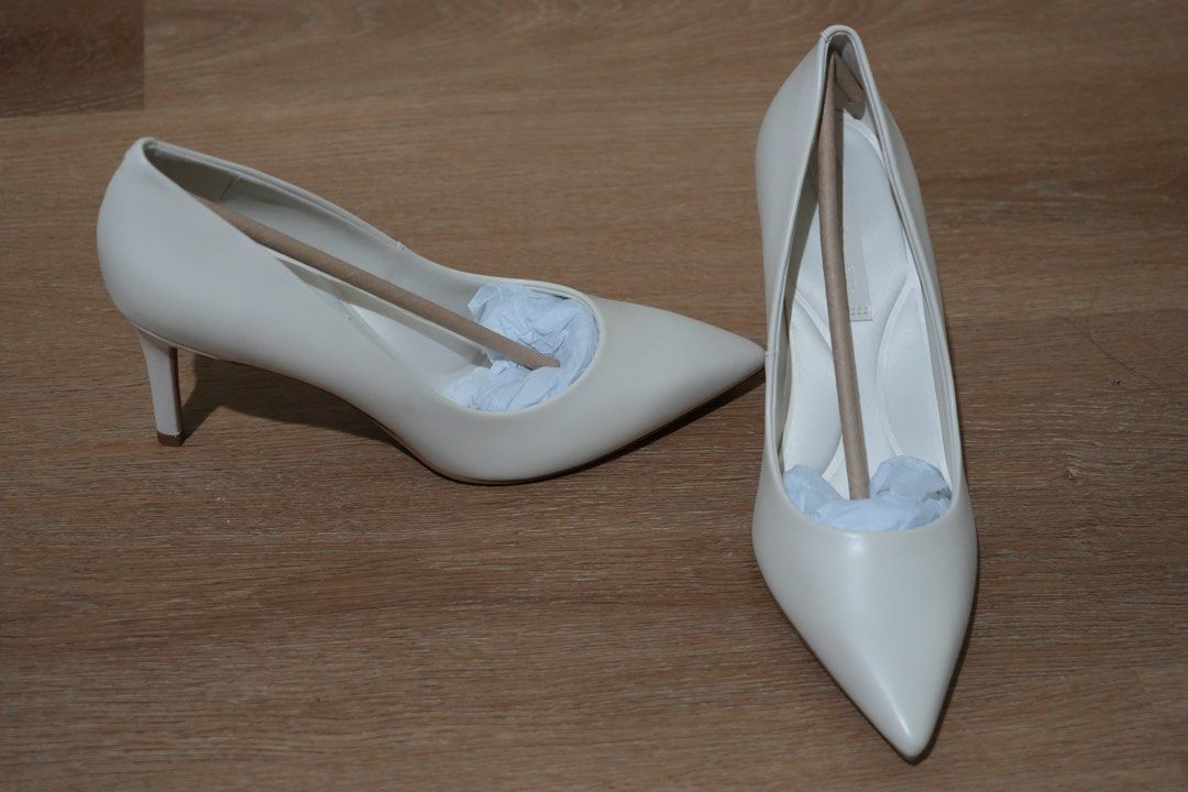 Charles & Keith White Stiletto Pumps (Category: Heels) located in Cainta. Submitted by karsssss (Listing ID 1465756857, Image 3). Description: - Brand: Charles & Keith - Color: Chalk White - Style: Pointed Stiletto Pumps - Design: Classic and versatile - Occasion: Perfect for work/wedding/ events - Features: Comfortable padded insoles, moderate heel height - size 37.