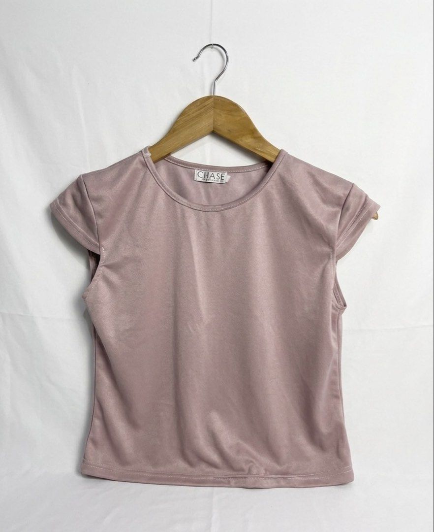 CHASE Dusty Rose Cap Sleeve Top (Category: Blouses) located in Manila. Submitted by goldenprngs101 (Listing ID 1463089396, Image 3). Description: Small - Dusty rose cap sleeve top - Brand: CHASE - Simple and classic design - Fabric has a slight sheen - Versatile for casual or dressed-up occasions - Easy to pair with various outfits B: 34” L: 18” #DustyPink #SemiCropTop #Top #Pastel #DustyRose #PrelovePH #Small .