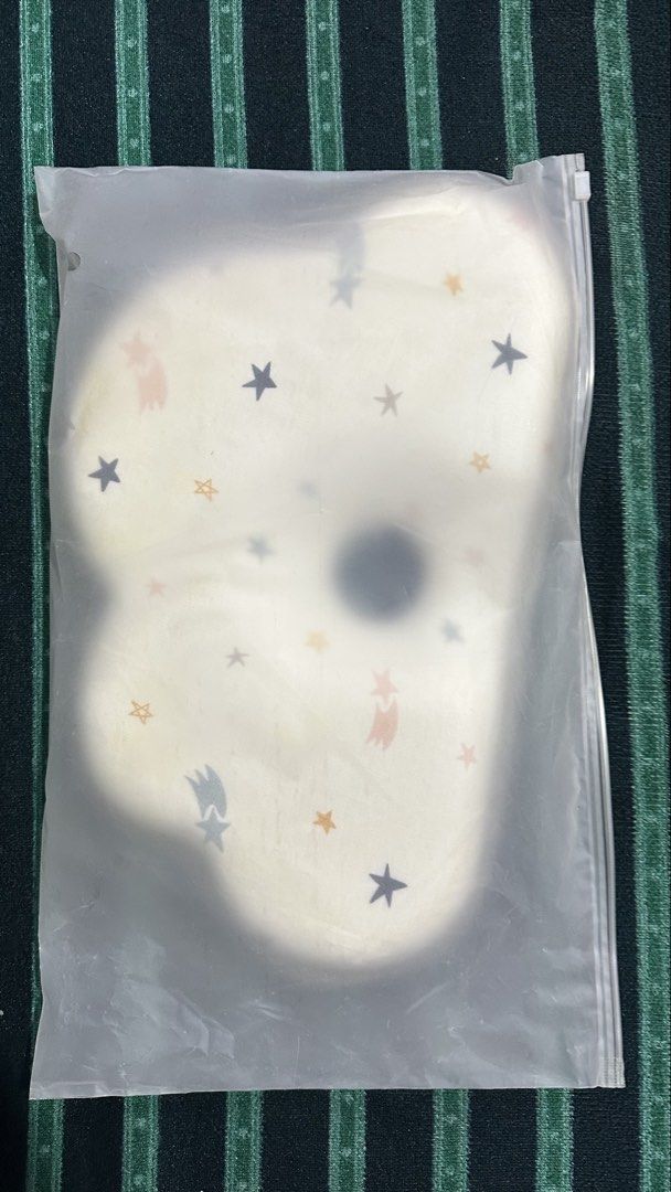 Choc Chick Baby Memory Foam Pillow Starry Night (Category: Children's Beds) located in Manila. Submitted by kaexer11 (Listing ID 1465596472, Image 2). Description: - Brand: Choc Chick - Item: Memory foam baby pillow with central head support indentation - Design: Cream background with grey, yellow, and peach stars and shooting stars - Dimensions: 36 x 23 cm - Material: 100% cotton fabric cover - Inclusion: Original zip storage bag - Condition: Ex