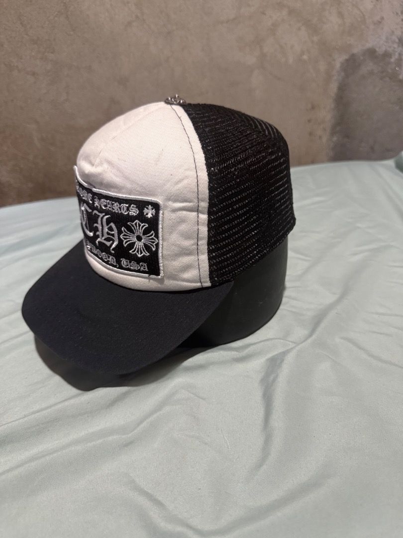 Chrome Hearts Hollywood Trucker Hat Black White (Category: Caps & Hats) located in Bislig. Submitted by zeazanayos15674 (Listing ID 1465596403, Image 2). Description: - Brand: Chrome Hearts - Style: Black and white trucker hat with mesh back panels - Details: Iconic silver dagger top button accent - Front: Embroidered Hollywood patch logo on structured foam - Closure: Adjustable snapback - Condition: Clean, excellent, ready to wear - Shipping or 