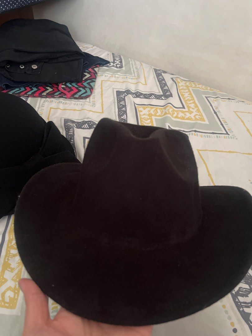 Classic Black Fedora Hat Cowboy Style (Category: Caps & Hats) located in Pasig City. Submitted by jnzmrq1003 (Listing ID 1465602027, Image 2). Description: - Color: Solid black - Design: Wide brim and pinched crown shape - Material: Sturdy, structured fabric that holds its shape well - Versatility: Simple and stylish, ideal for daily wear or outdoor events - Condition: Brand new and ready to ship!.