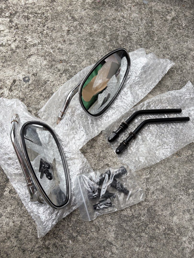 Classic side mirrors with extra stems (Category: Everything Else Others) located in Manila. Submitted by finderskeepersmnl_092026 (Listing ID 1465701026, Image 1). Description: - Pair of classic chrome motorcycle rearview mirrors - Includes a set of alternative black angled stems for custom looks - Comes with a complete bag of mounting bolts and adapters - Features standard thread types compatible with most motorcycle bases - Condition: Brand new