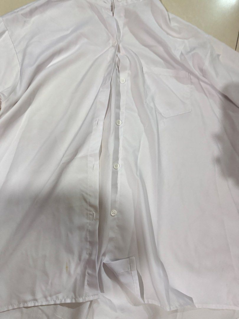 Classic White Button-Up Long Sleeve Shirt (Category: Longsleeves) located in Quezon City. Submitted by sweetlyluxe (Listing ID 1465624531, Image 2). Description: - Color: Plain white - Style: Long sleeves, classic collar, chest pocket, curved hem (longer in back) - Material: Soft, lightweight fabric - Versatility: Perfect for office wear or casual layering.