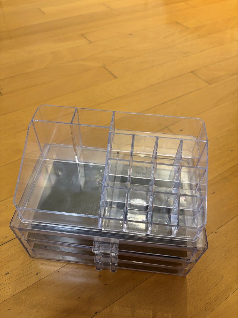 Clear Acrylic Makeup Organizer with 3 Drawers (Category: Makeup) located in Pasig City. Submitted by sparky.shop (Listing ID 1465674514, Image 2). Description: - Clear acrylic makeup organizer for a sleek vanity setup - Includes 3 smooth pull-out drawers with black mesh anti-slip mats - Top section features multiple lipstick slots and open compartments for brushes and bottles - Removable top tray piece for versatile storage - Sturdy plastic const