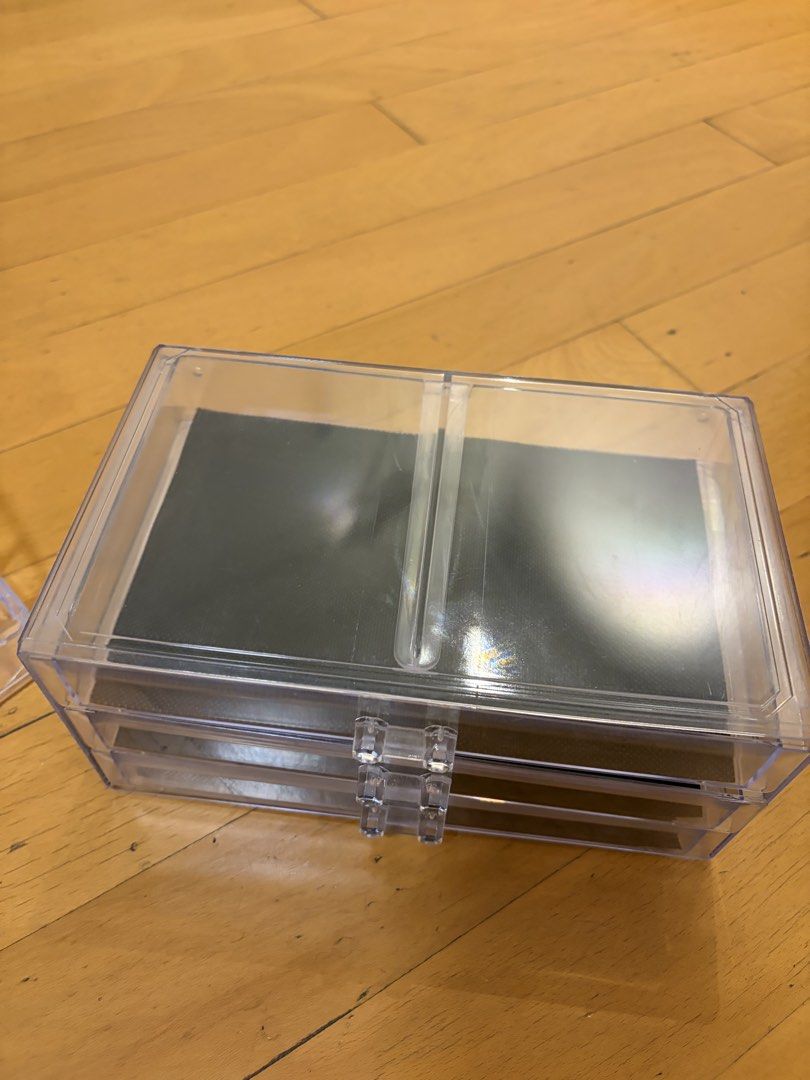 Clear Acrylic Makeup Organizer with 3 Drawers (Category: Makeup) located in Pasig City. Submitted by sparky.shop (Listing ID 1465674514, Image 3). Description: - Clear acrylic makeup organizer for a sleek vanity setup - Includes 3 smooth pull-out drawers with black mesh anti-slip mats - Top section features multiple lipstick slots and open compartments for brushes and bottles - Removable top tray piece for versatile storage - Sturdy plastic const