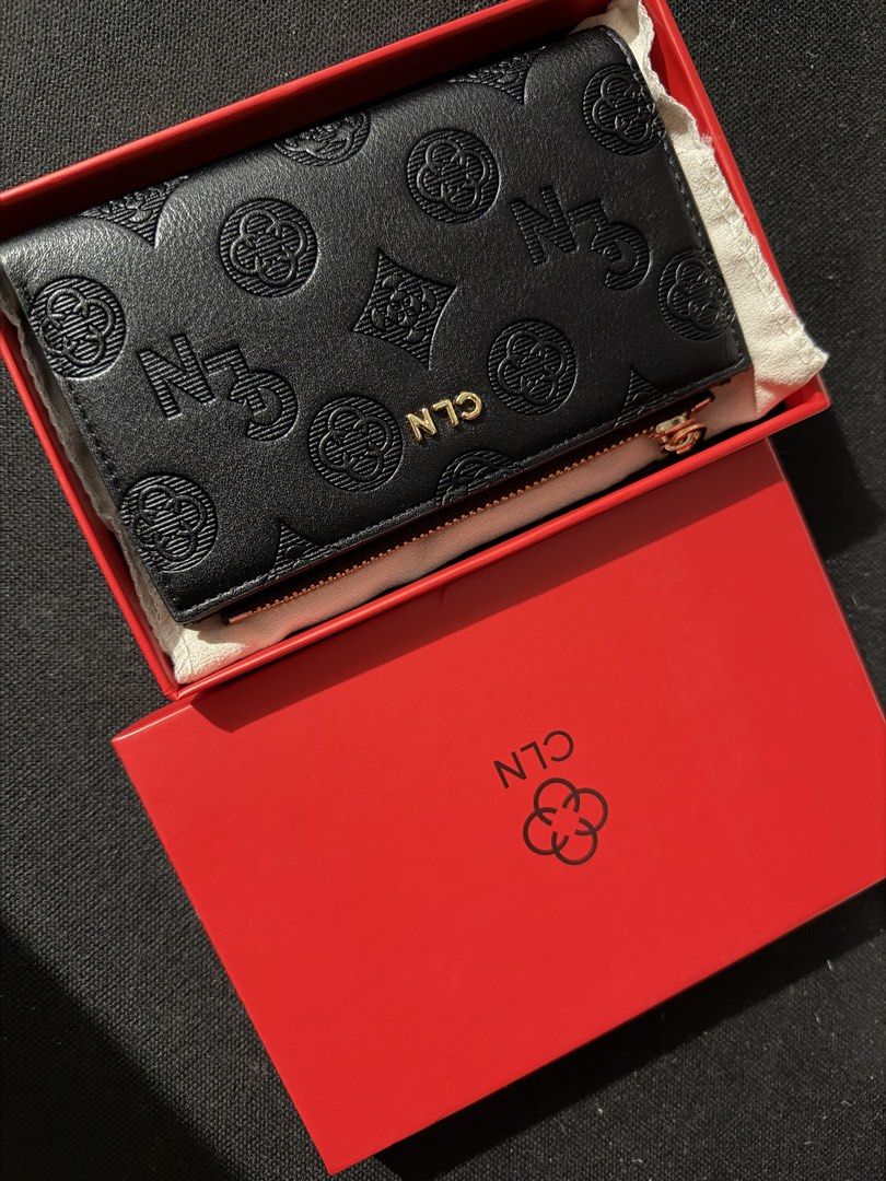 CLN Black Monogram Wallet with Red Box (Category: Wallets & Card holders) located in Malabon City. Submitted by annshopable_ (Listing ID 1465641182, Image 1). Description: - Brand: CLN - Color: Black with all-over debossed monogram pattern - Hardware: Gold-tone zipper and snap button closure - Features: Multiple card slots and a convenient ID window - Condition: Brand new, never used, with clean interior - Inclusions: Original red presentation bo