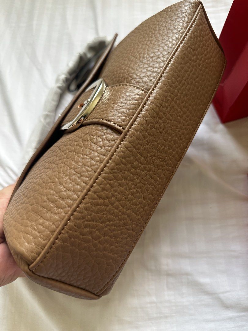 CLN Brown Pebble Leather Shoulder Bag with Buckle (Category: Shoulder Bags) located in Manila. Submitted by calingasan29834 (Listing ID 1465604247, Image 3). Description: - Brand: CLN - Material: Brown pebble leather - Condition: Brand new with original tag attached and protective wrapping on strap - Closure: Magnetic snap closure - Details: Silver tone buckle on front flap - Interior: Includes a zippered pocket with plenty of room for everyday e