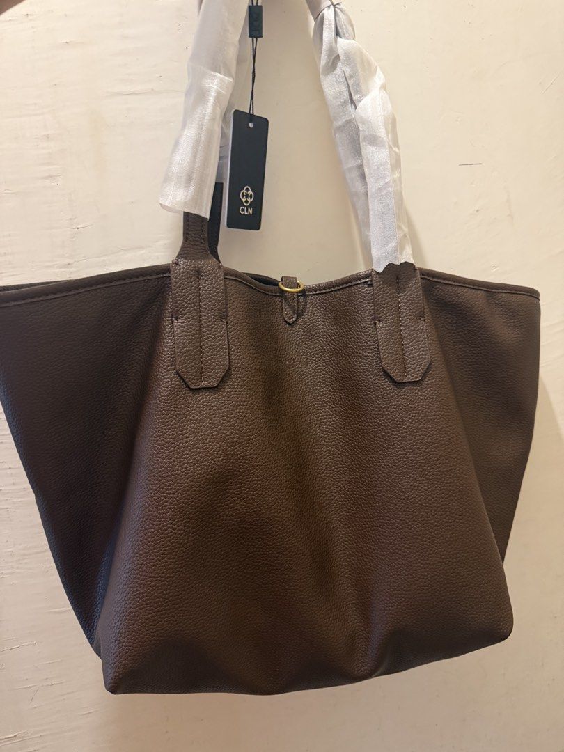 CLN Kellyns Tote Bag Brown (Category: Tote Bags) located in Cebu City. Submitted by iamish_items (Listing ID 1465706440, Image 1). Description: - Brand: CLN - Model: Kellyns Tote Bag - Color: Rich brown - Condition: Brand new with store tags attached, handles still wrapped in original paper - Design: Reversible (textured faux leather on one side, canvas with large CLN logo on the other) - Inclusions: Matching inner pouch with zip closure - Featur