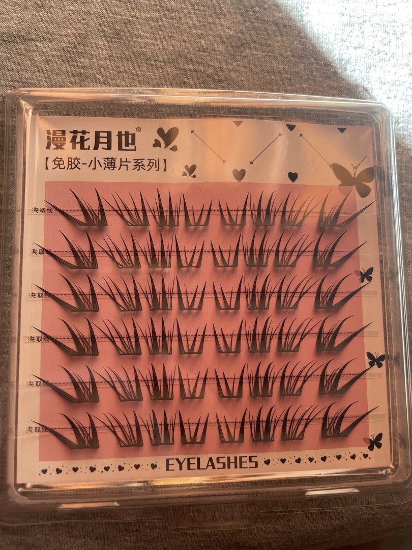 cluster eyelashes pink packaging box (Category: Makeup) located in Manila. Submitted by tabayjane158126 (Listing ID 1465619036, Image 2). Description: - Product: cluster false eyelashes - Packaging: Cute pink case with a clear lid and original tray - Style: Small thin strip series with multiple rows of individual lashes - Condition: Brand new, clean, and completely unused - Features: Easy to apply, lightweight and natural-looking. 3 for 100 Yes t