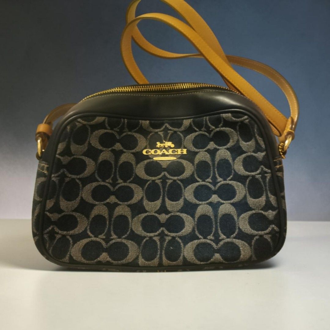 Coach bag: mini jamie (Category: Cross-body Bags) located in Manila. Submitted by kayesellsit (Listing ID 1465680385, Image 2). Description: I have 2 available items. 1 mini jamie blue denim. 1 mini jamie walnut. Coach mini jamie cambag on-hand* Inclusion tag and carecard Guaranteed original for only 6,999 Product details Signature coated canvas and smooth leather Two credit card slots Inside multifunction pocket Zip closure, fabric lining Outsid