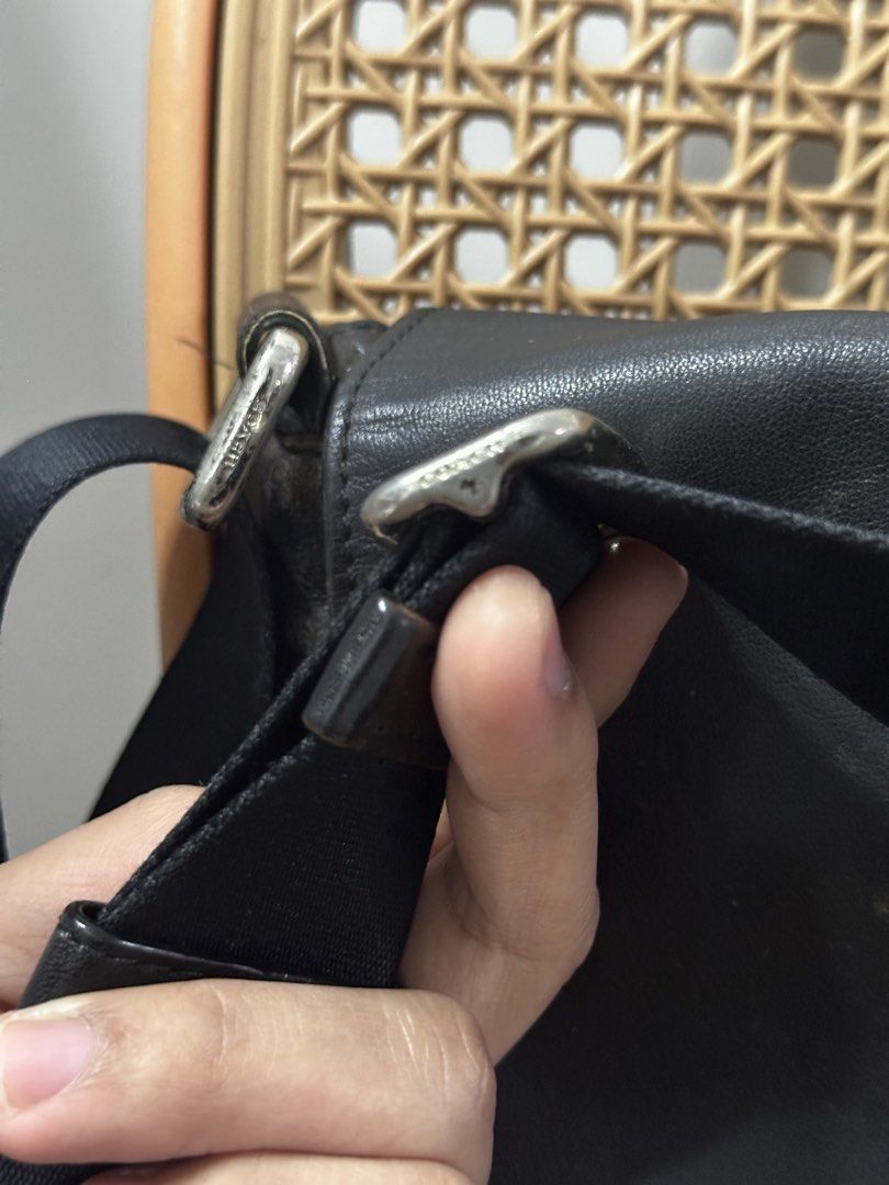 Coach Black Leather Signature Messenger Bag (Category: Sling Bags) located in Tarlac. Submitted by wearagainboutique (Listing ID 1465660740, Image 3). Description: - Authentic Coach messenger bag in classic black leather and signature C fabric - Adjustable crossbody strap equipped with durable metal hardware - Flap top closure featuring a subtle debossed Coach logo - Spacious interior lined with fabric and includes the iconic Coach storypatch - E