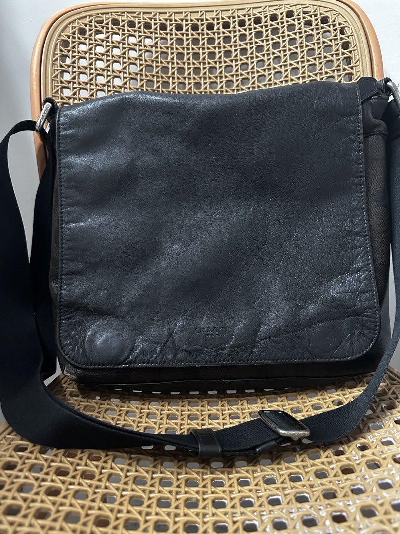 Coach Black Leather Signature Messenger Bag (Category: Sling Bags) located in Tarlac. Submitted by wearagainboutique (Listing ID 1465660740, Image 1). Description: - Authentic Coach messenger bag in classic black leather and signature C fabric - Adjustable crossbody strap equipped with durable metal hardware - Flap top closure featuring a subtle debossed Coach logo - Spacious interior lined with fabric and includes the iconic Coach storypatch - E