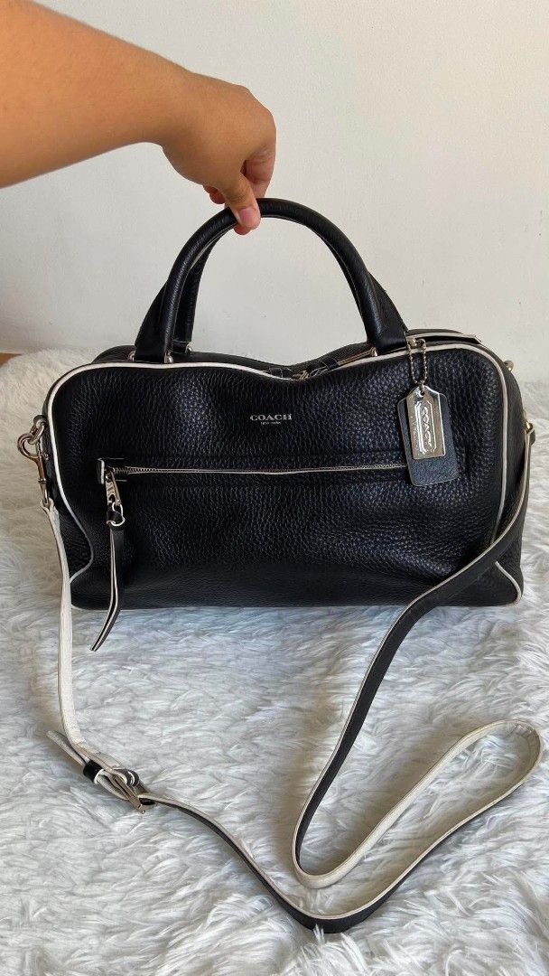 Coach Bleecker Edgepaint Leather Toaster Satchel (Category: Luxury Bags & Wallets) located in Bulacan. Submitted by bella.ken.varietystore (Listing ID 1465733154, Image 3). Description: - Brand: Coach New York - Material: Premium black pebbled leather with contrasting white piping - Hardware: Silver-tone hardware with classic Coach hangtag - Pockets: Front zippered pocket with pull tag - Straps: Double top handles plus an adjustable, detachable t
