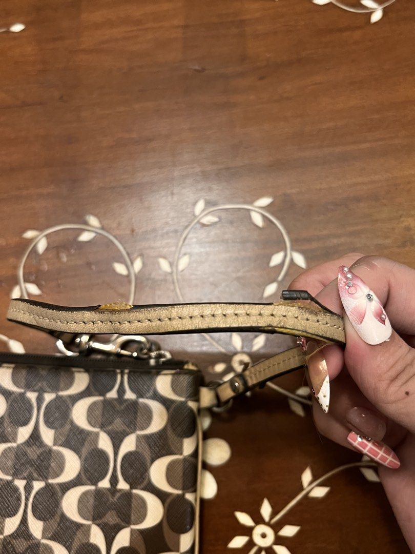 Coach Brown Coated Canvas Wristlet (Category: Luxury Bags & Wallets) located in Manila. Submitted by lalalens._ (Listing ID 1465674483, Image 3). Description: vintage coach monogram printed leather wristlet good leather body condition, handle has tears (see pics for condition). fixed price + SF !.