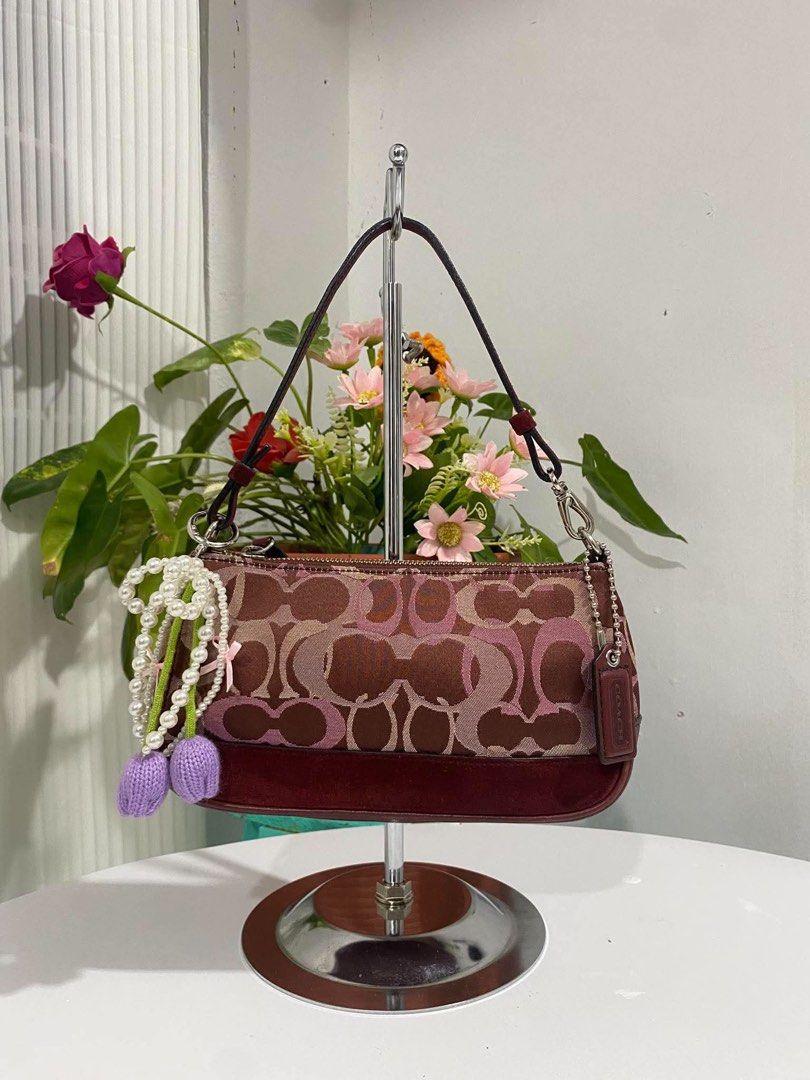Coach Demi Burgundy Canvas/Suede (Category: Shoulder Bags) located in Cebu City. Submitted by gummybearsworld (Listing ID 1465594612, Image 1). Description: like new theres a little bleed on the handle please see photo can do bundle on my other bags dm me.